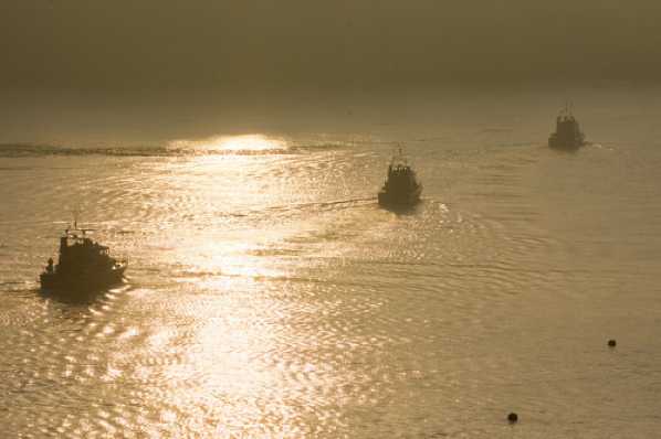 24 March 2020 - 07-16-34 
University Squadron Archer class river patrol vessels. In order from the rear;  HMS Smiter (P272), HMS Exploit (P167)  & HMS Blazer (P279) set off in a warm sunrise.
------------
Archer class: HMS Blazer, HMS Exploit HMS Smiter